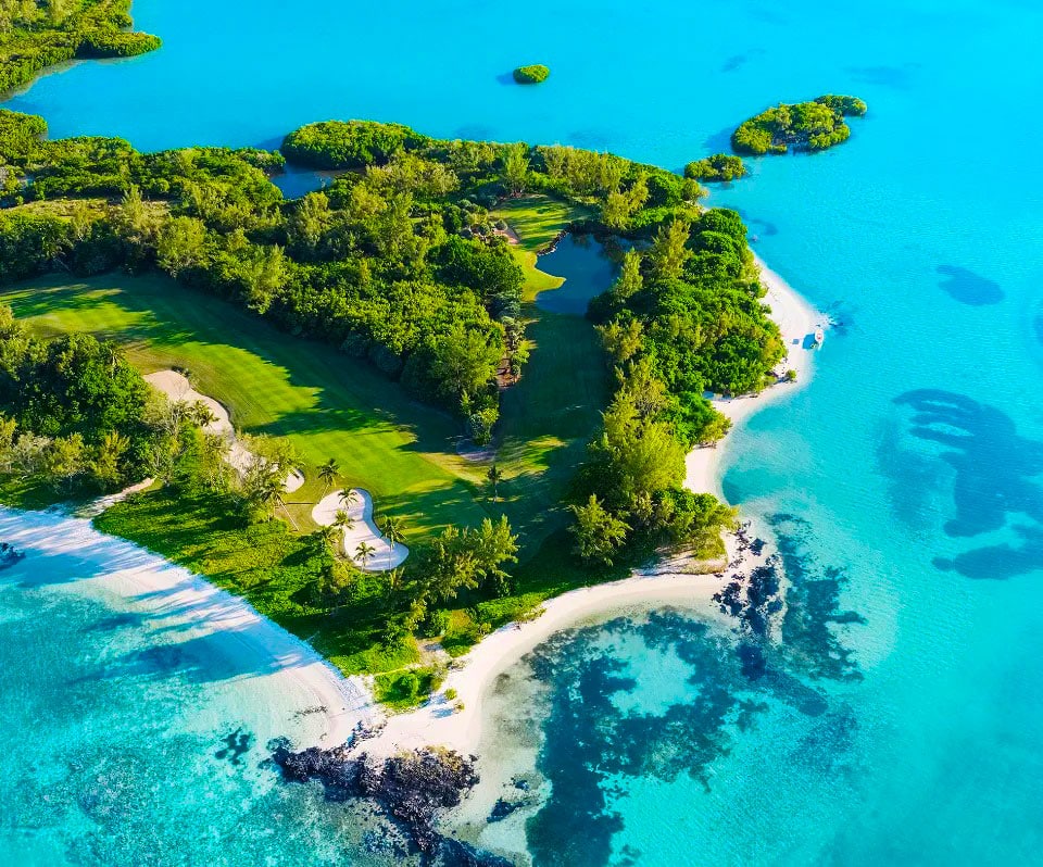 Aerial view of white beaches, green islets and turquoise lagoon in Mauritius